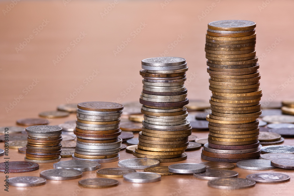 piles of coin increasing in height piles of coin increasing in height