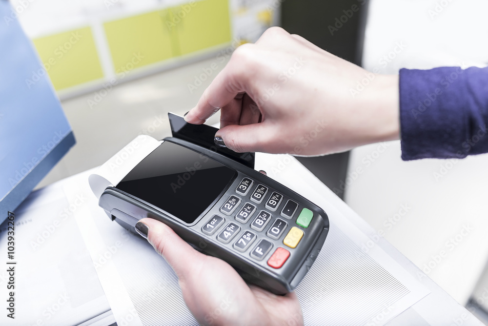 Debit card swiping on pos terminal. Debit card swiping on pos terminal.