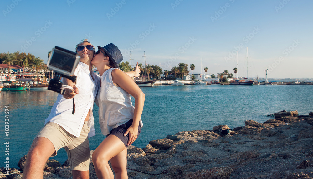 Young couple take their kissing self photo