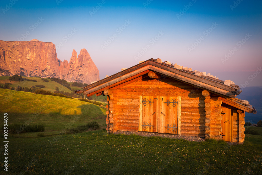 Cabin at Seiser Alm with Schlern mountain, South Tyrol, Italy