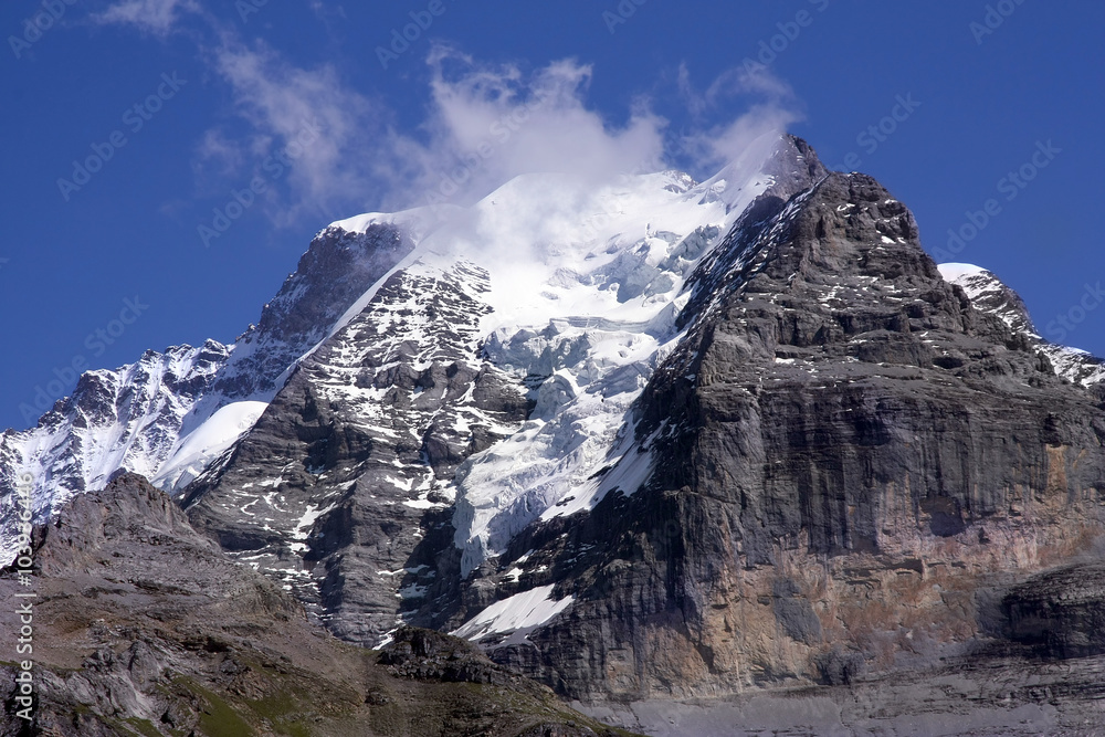Swiss mountain summit: Jungfrau wrapped in clouds