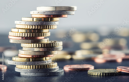 Euro coins. Euro money. Euro currency.Coins stacked on each other in different positions. Money concept. photo