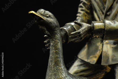 Exclusive chess Ostap Bender from silver, gold and precious stones. - Man holds a goose head photo