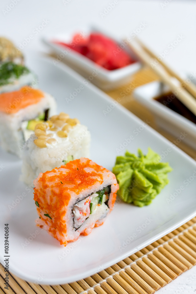 Sushi set on white wooden background Sushi set on white wooden background