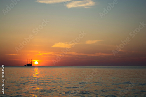 oil platform against beautiful sea sunset © samael334
