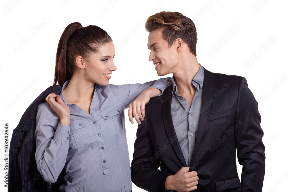 Proud business couple looking at camera isolated on white backgr Proud business couple looking at camera isolated on white backgr