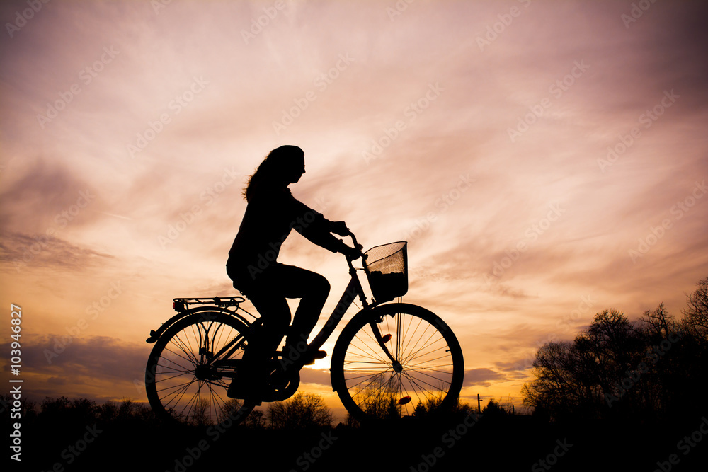 Silhouette of the girl on bicycle - beautiful sunset Silhouette of the girl on bicycle - beautiful sunset