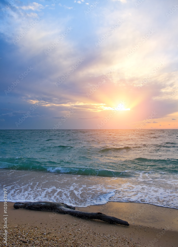 Sunset on the beach in summer time