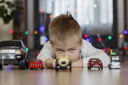 The boy with toy cars