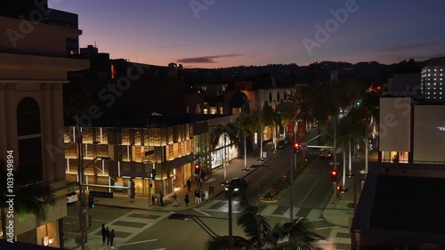 BEVERLY HILLS, CA - Circa February, 2016: A high-angle night time lapse view of an intersection on Rodeo Drive.  	