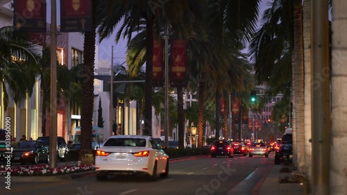 BEVERLY HILLS, CA - Circa February, 2016: An evening establishing shot of traffic on Rodeo Drive.  	