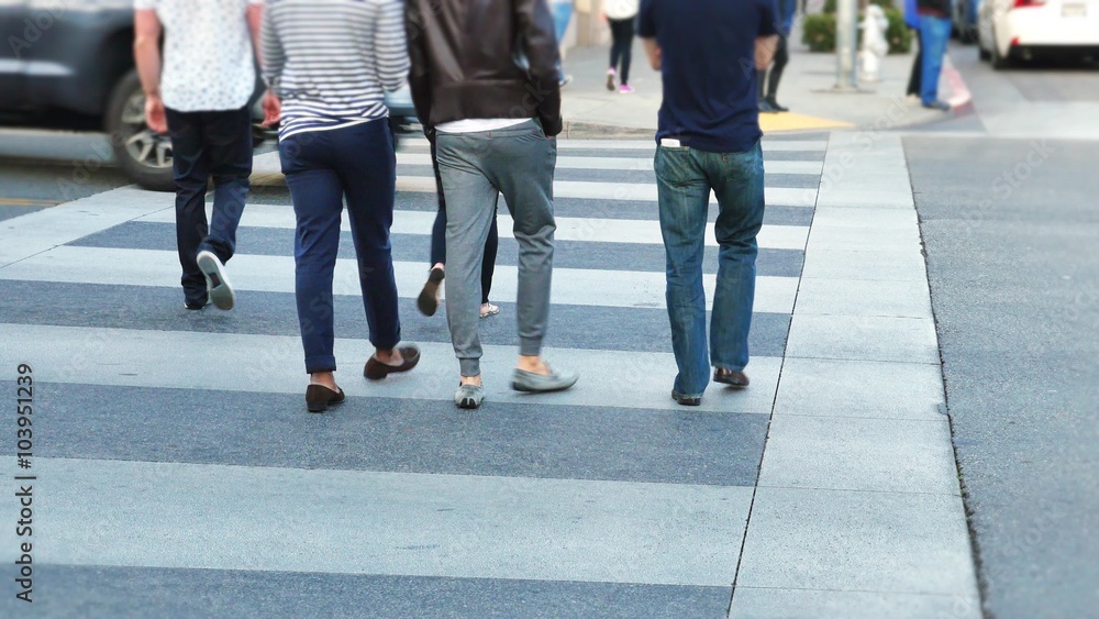 People walking in a crosswalk on Rodeo Drive in Beverly Hills. People walking in a crosswalk on Rodeo Drive in Beverly Hills.