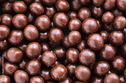 Brown chocolate dragee balls background