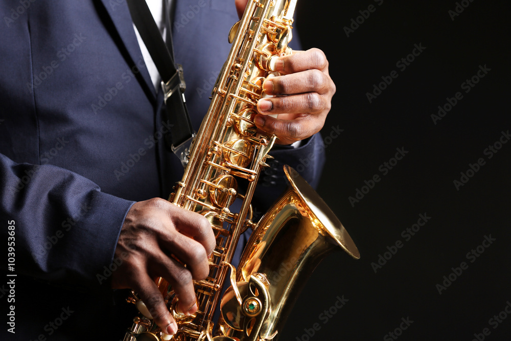 Obraz premium African American jazz musician playing the saxophone, closeup