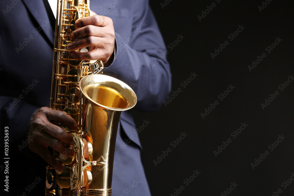 Fototapeta premium African American jazz musician playing the saxophone, closeup
