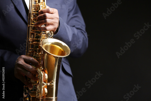 African American jazz musician playing the saxophone, closeup