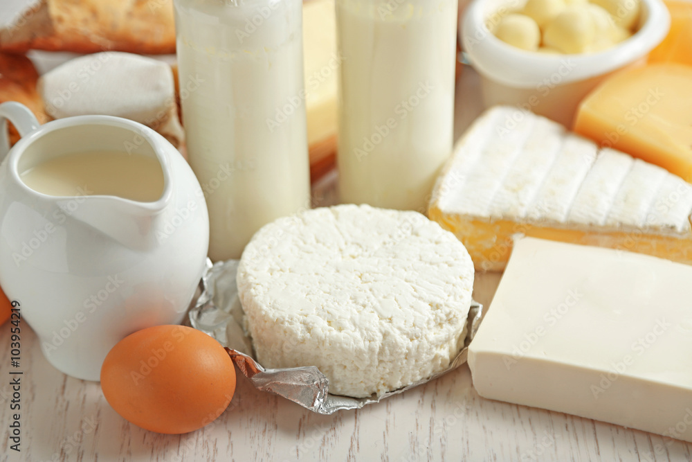 Set of fresh dairy products on white wooden table Set of fresh dairy products on white wooden table