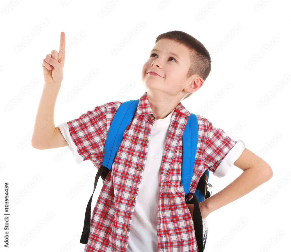 Portrait of little boy with back pack pointing finger upwards, isolated on white Portrait of little boy with back pack pointing finger upwards, isolated on white