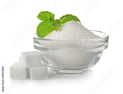 Pile of sugar cubes and stevia isolated on white background photo