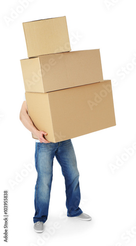 Man holding pile of carton boxes isolated on white background © Africa Studio