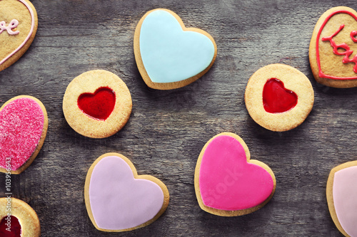 Assortment of love cookies on wooden background