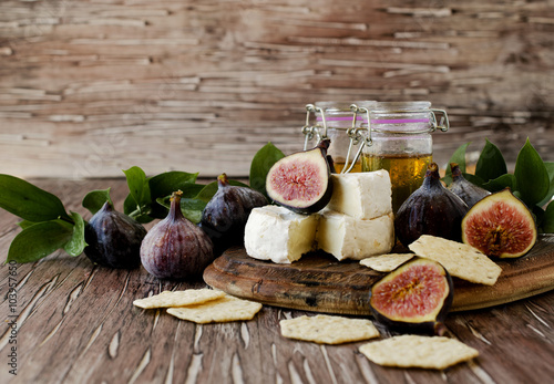 figs with cheese and honey , selective focus