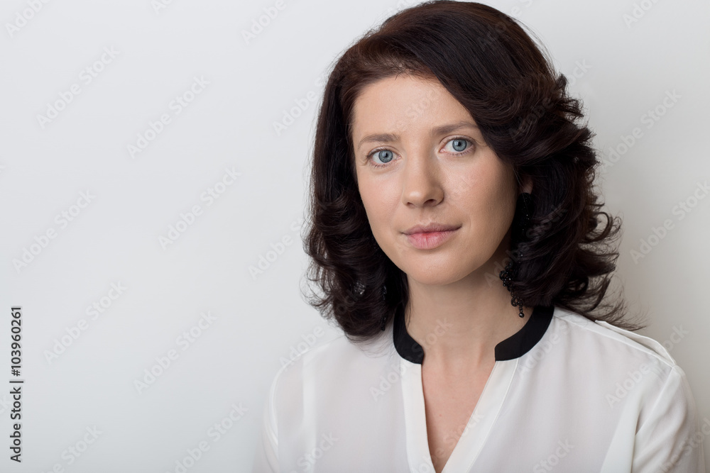beautiful elegant woman demonstrates the application of makeup on a white background in studio beautiful elegant woman demonstrates the application of makeup on a white background in studio