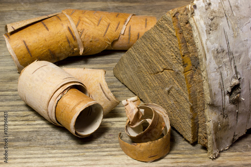 Tablou pe pânză Rolls of birch Bark on wooden