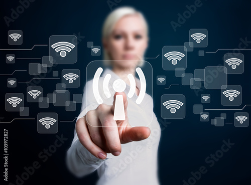 Photos Social network business WiFi woman presses button wi fi
