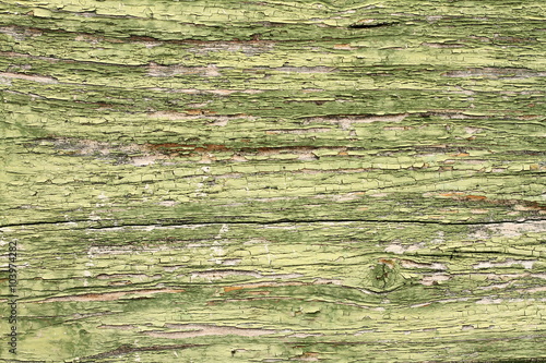 cracked old green paint on wood
