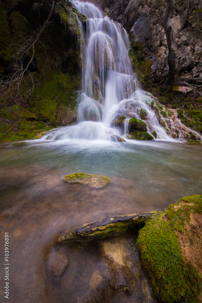 Fototapeta premium Beautiful waterfalls and mountain stream in Transylvania, in early spring
