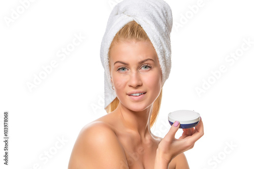 Beautiful spa girl holding jar of cream. Closeup