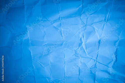 Blue cardboard sheet of paper. creased paper background.