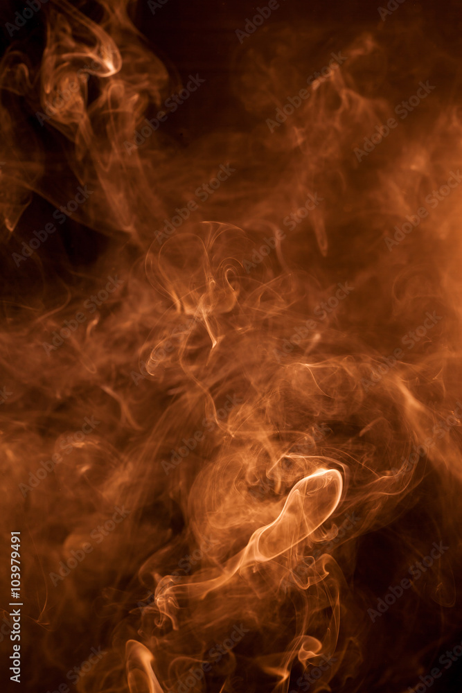 Fototapeta premium Gold smoke on a black backgroug.