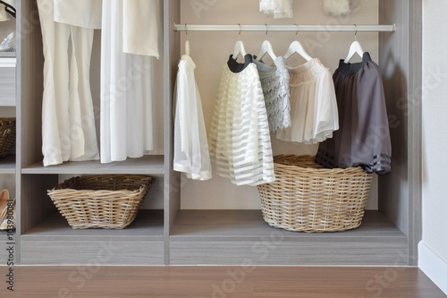 Canvas Print modern closet with row of white dress and shoes hanging in wardrobe