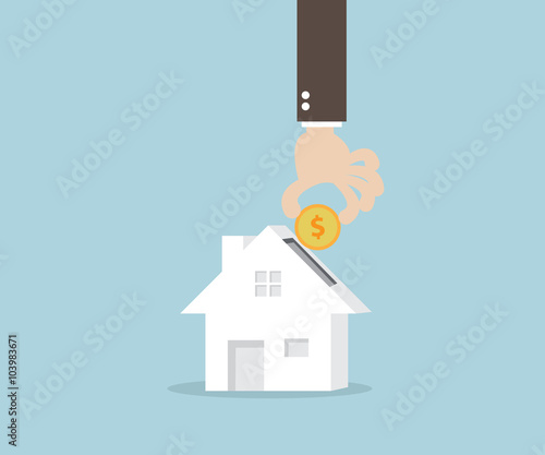 Hand Putting Money Coin Into Home