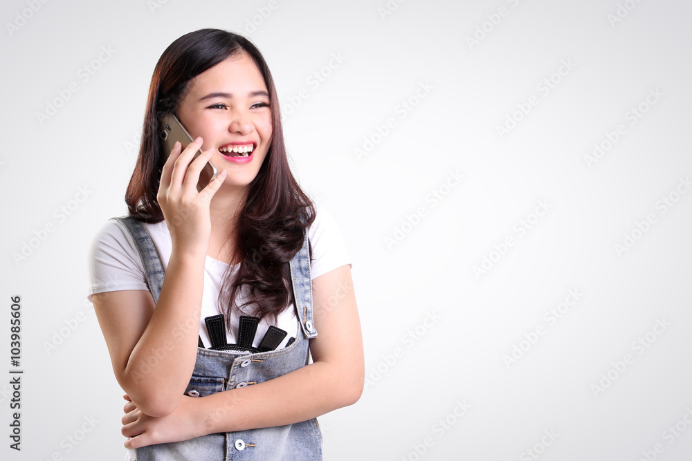 Girl on phone laughing, isolated copy-space Girl on phone laughing, isolated copy-space