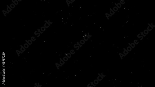 Dust Particles on Black Background slowly blown by Wind photo