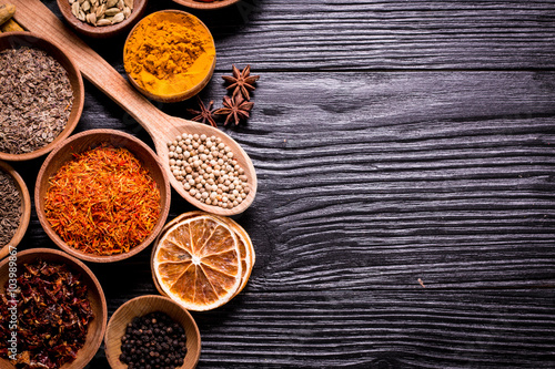 spices and herbs on wooden table.