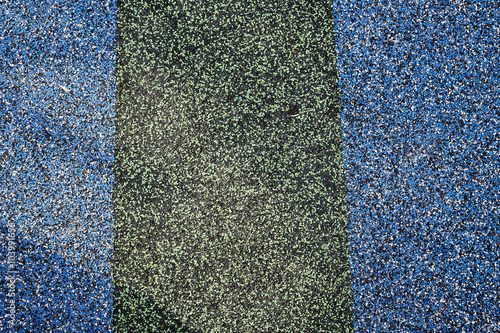 Texture. Childrens playground floor.Rubber and stones. photo