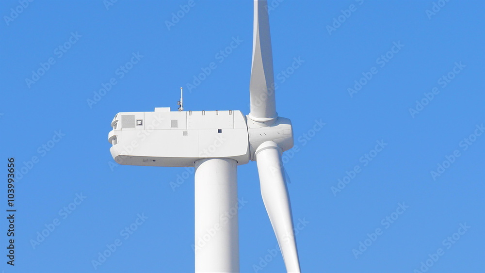 Close up of wind turbine spinning from the side
Close up of wind turbine spinning from the side