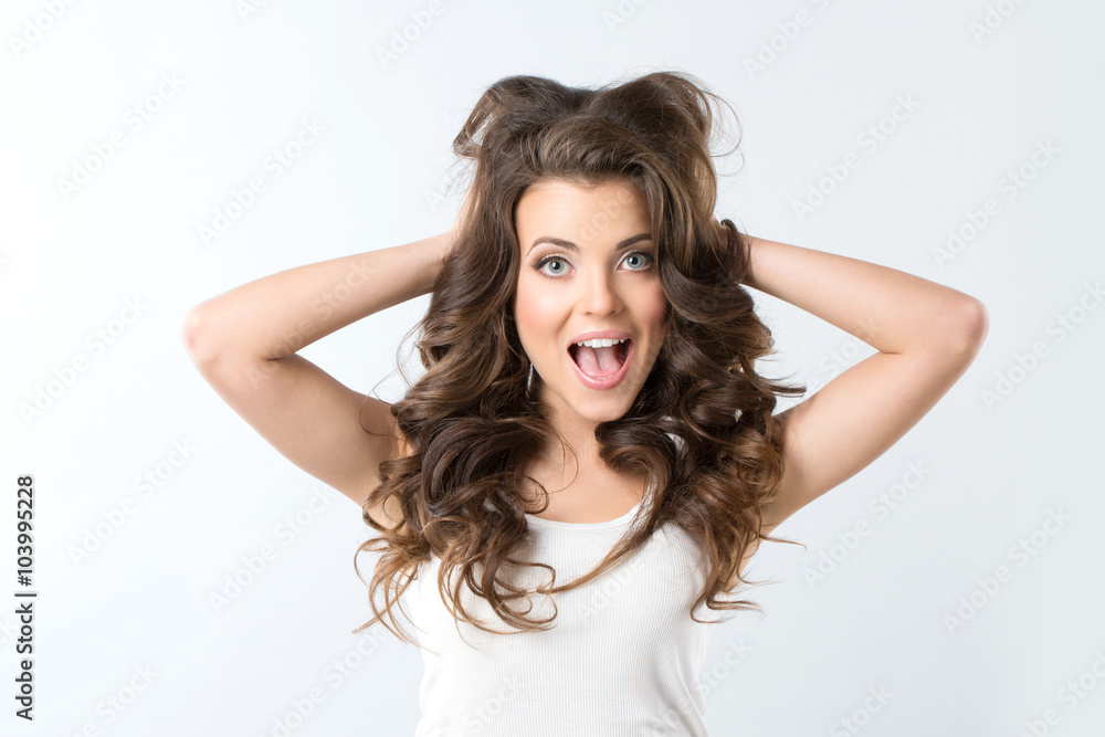 Amazement - woman excited looking to the side. Surprised happy young woman. Amazement - woman excited looking to the side. Surprised happy young woman.