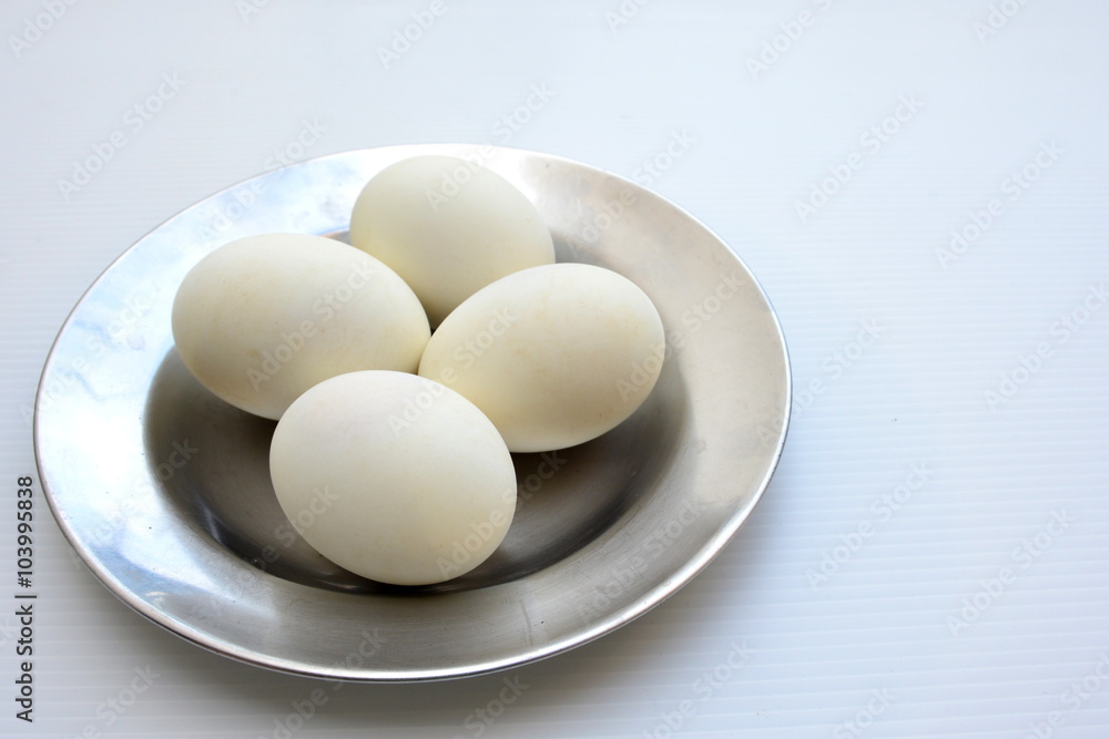 Salted duck eggs in dish on white background. Salted duck eggs in dish on white background.