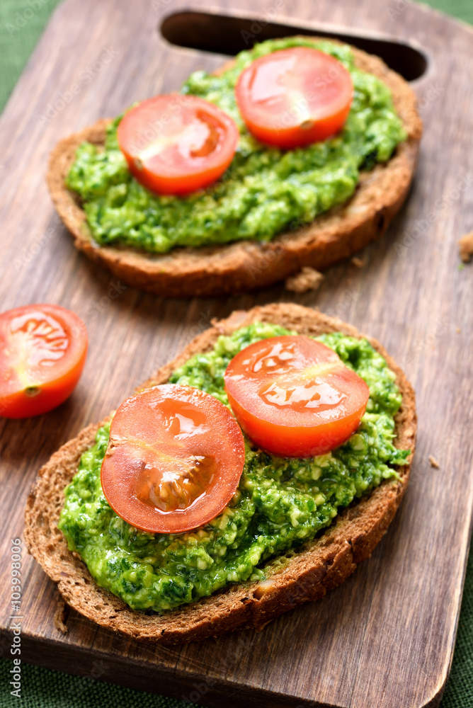 Bruschetta with pesto sauce and tomatoes Bruschetta with pesto sauce and tomatoes