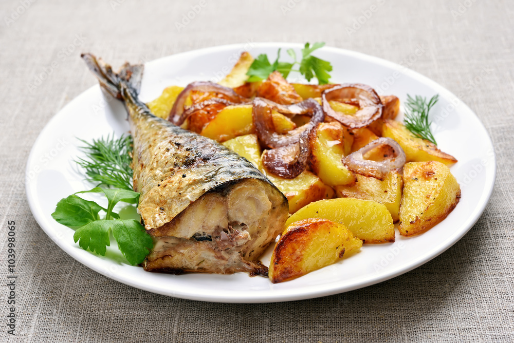 Fried mackerel fish with potato wedges Fried mackerel fish with potato wedges