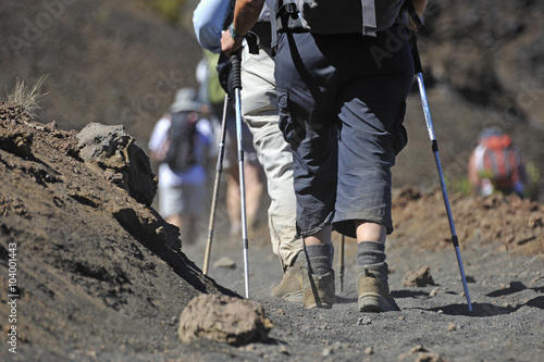Hikers walking on volcanic dirt in the Haleakala crater, Maui Island, Hawaii Islands, USA