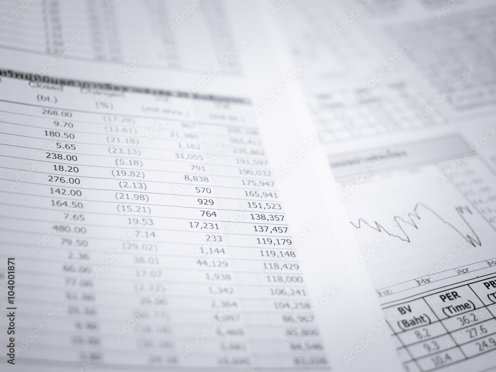 Business document over paper with chart in blue light. Business document over paper with chart in blue light.