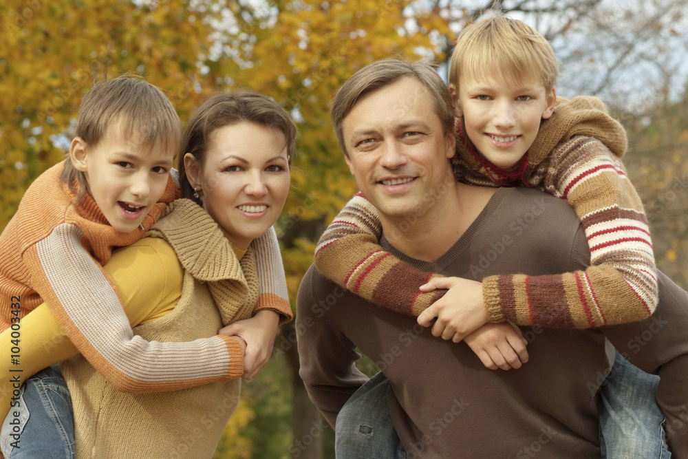 Fototapeta premium Happy family in autumn forest