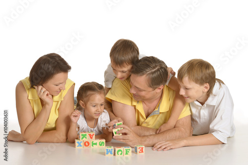 Cute family of a five playing