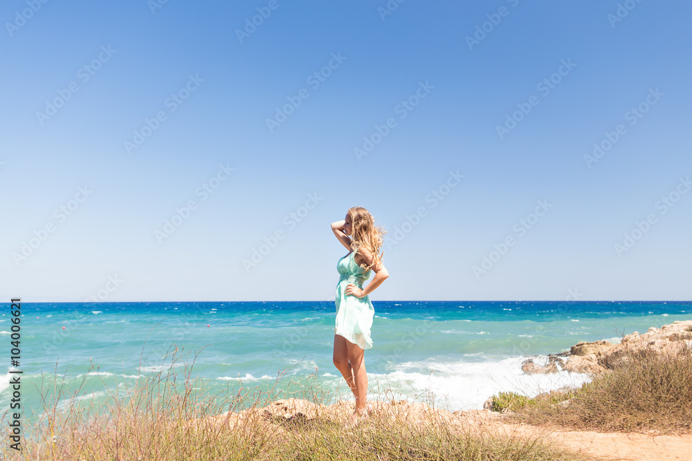 summer holidays and vacation concept - girl standing on the beach summer holidays and vacation concept - girl standing on the beach